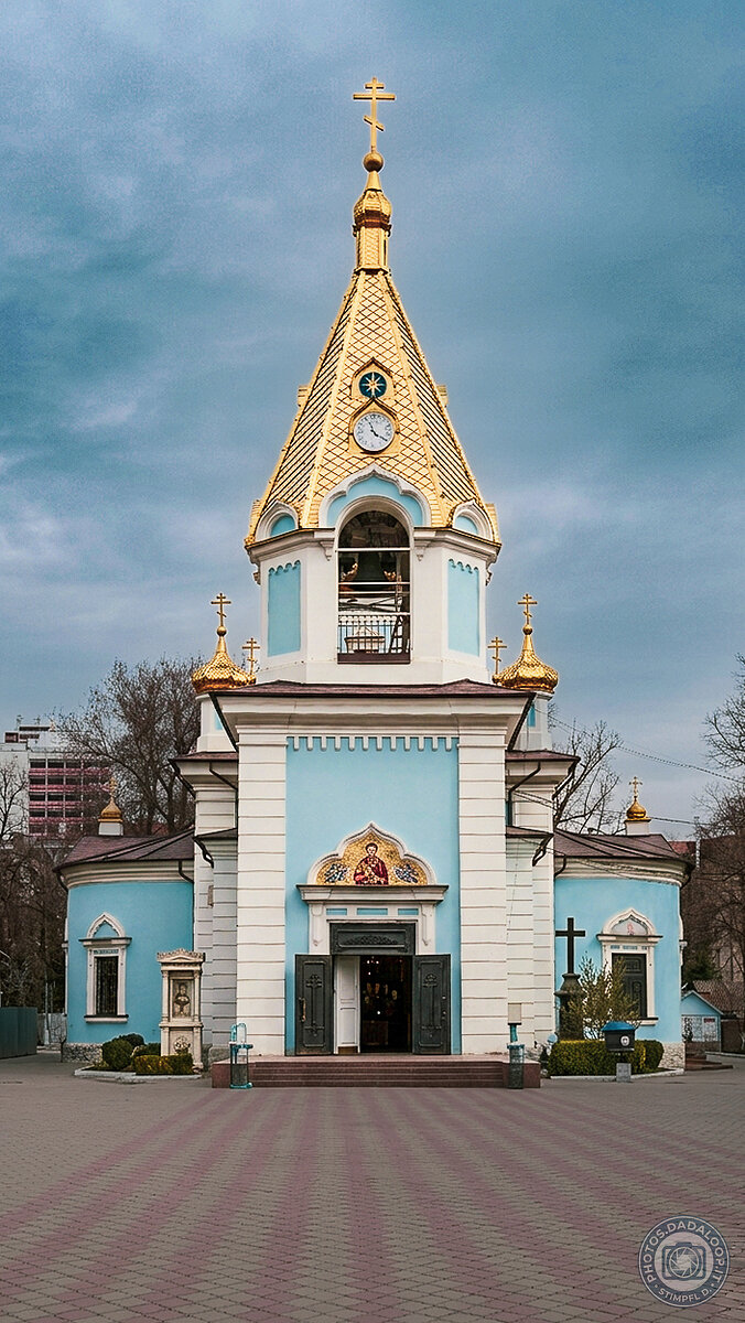 Orthodox church with golden dome under cloudy sky