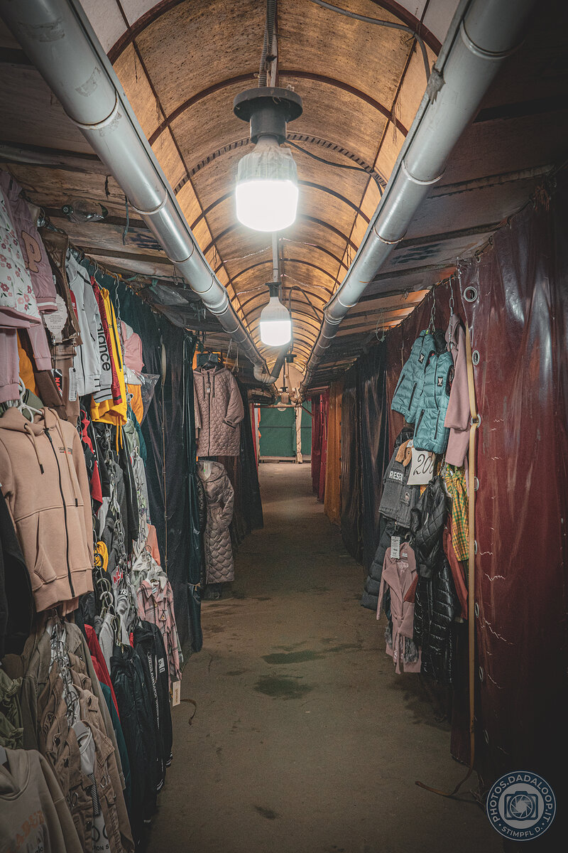 Illuminated stalls corridor in a covered market