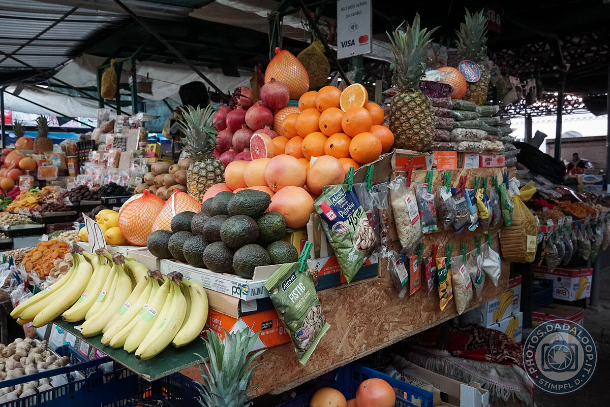 Colorful market stall with fruits and dried fruits