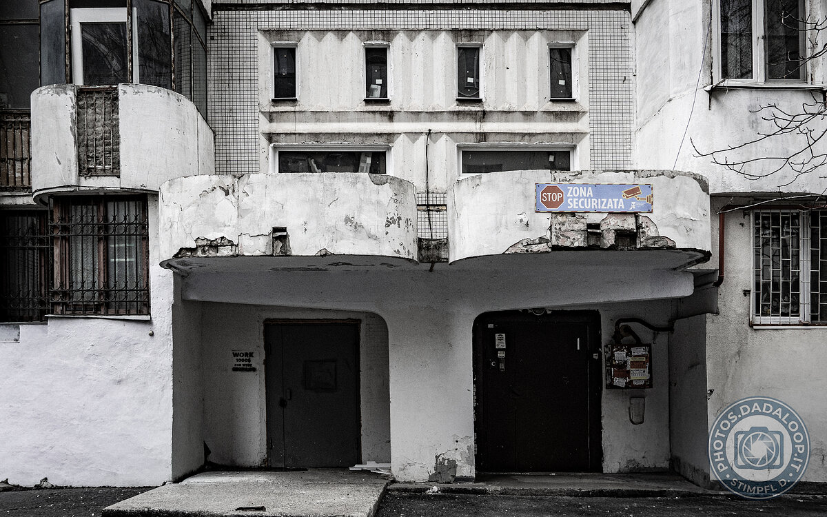 Dilapidated entrances of a Soviet building, decaying atmosphere
