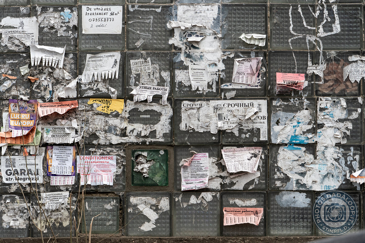 Wall of announcements and torn posters, Chișinău