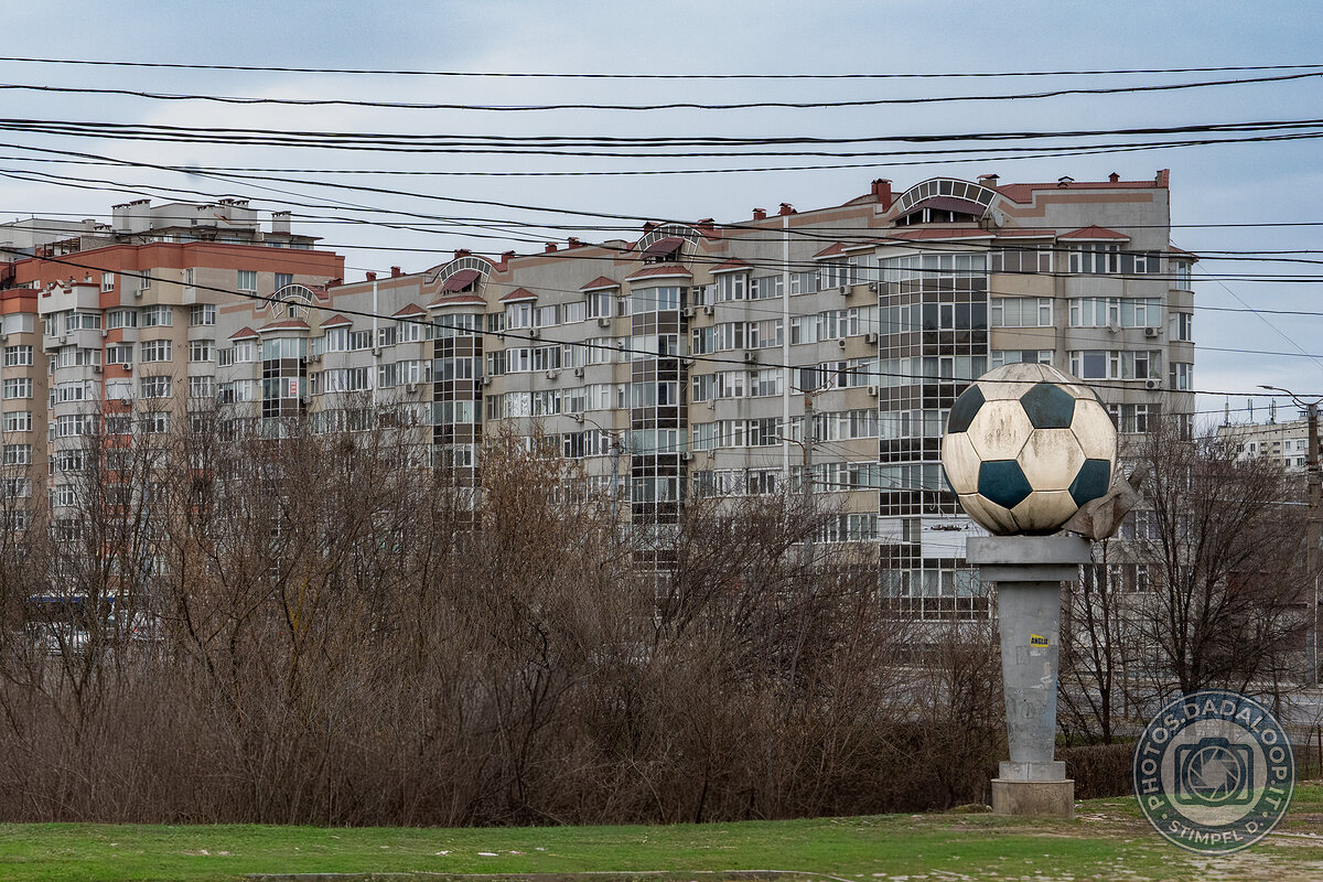 Soccer ball monument in an urban context