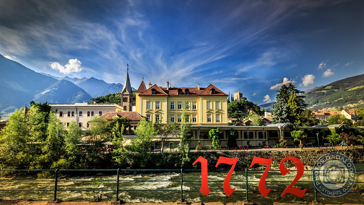 Urban view with river and mountains in the background