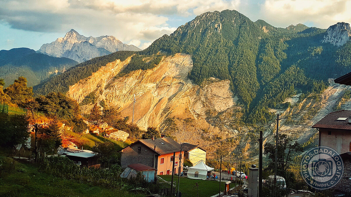 Mountain houses illuminated by the sunset